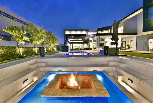Night render of 763 Eco Estate with pool and garden